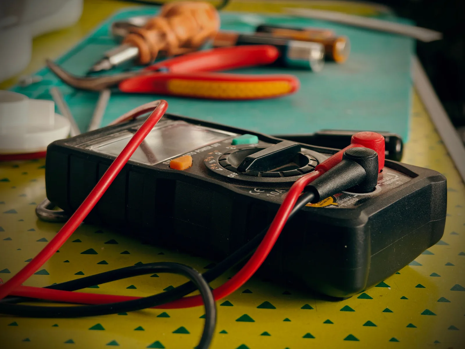 A multimeter and hand tools ready for a diagnostic visit, for electrician in Barrie