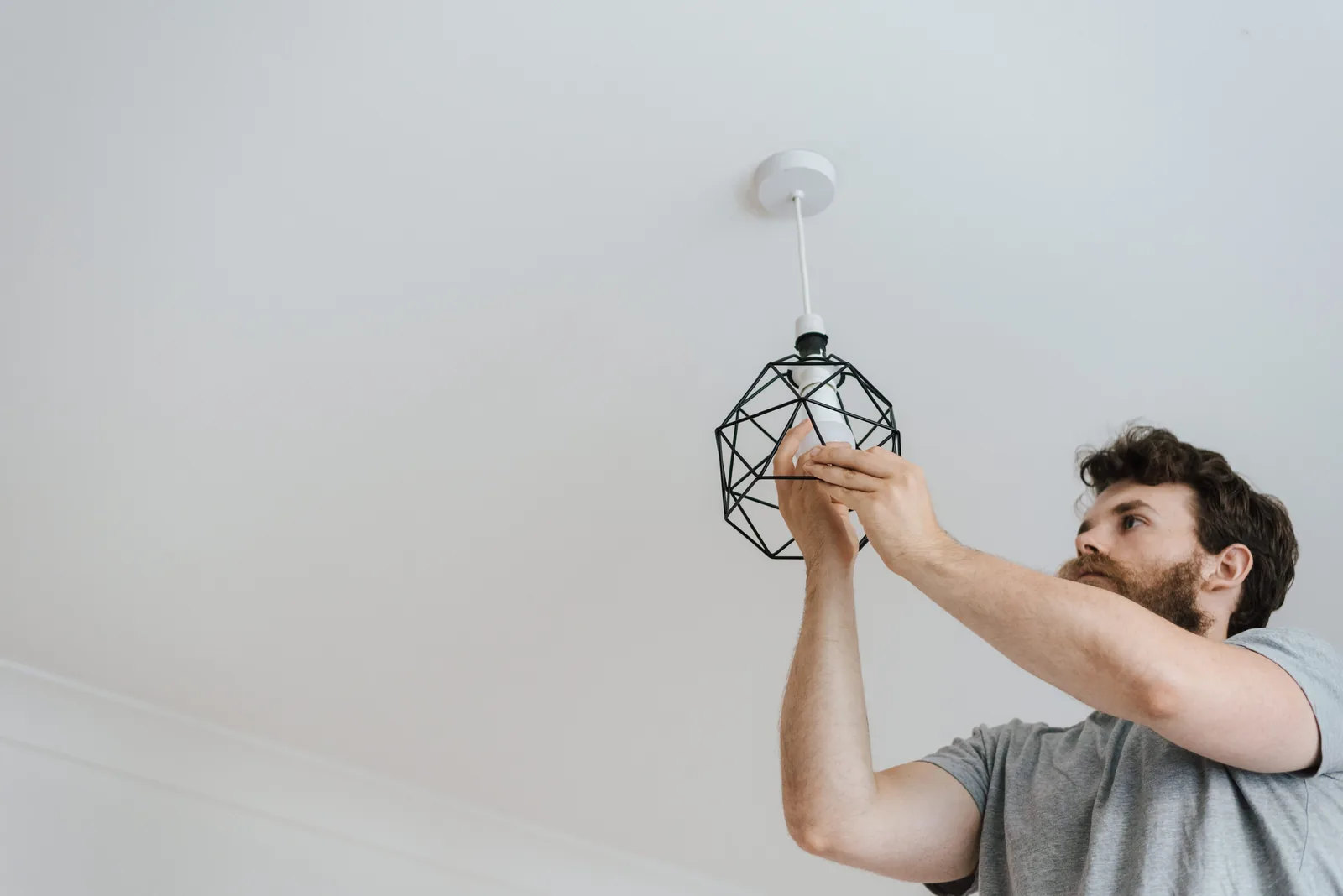 Fitting a lamp into a pendant fixture, for ceiling fan installation in Barrie